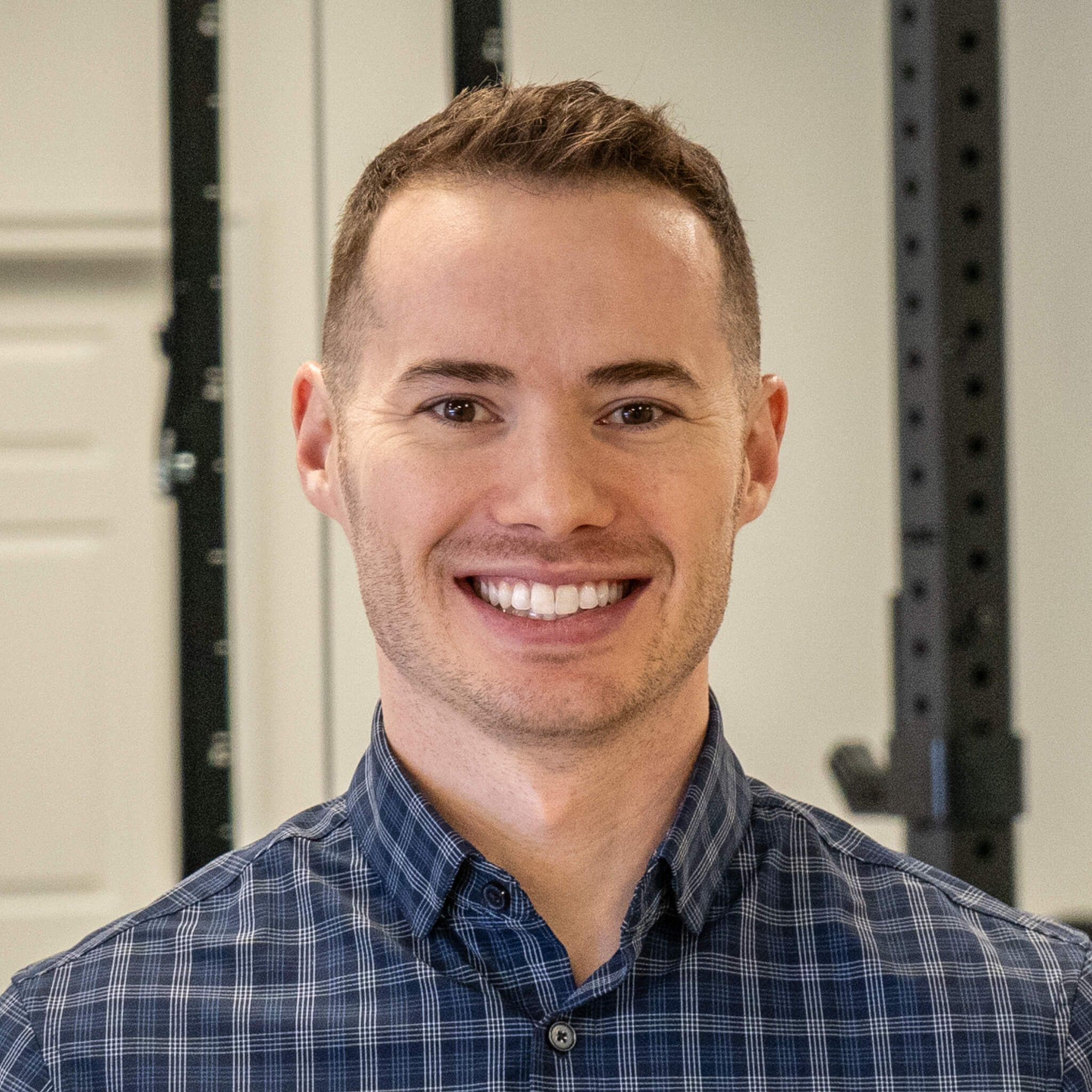 a man standing in front of a sign that says up and running physical therapy.