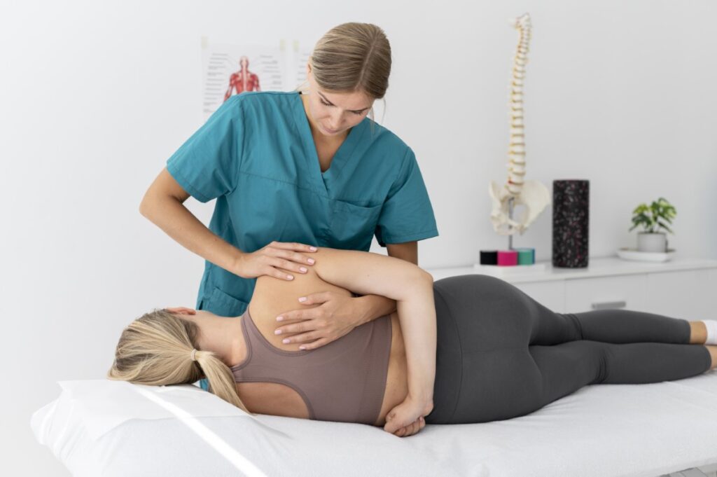 a woman getting a back massage from a doctor.